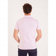 Polo uni détails col et broderies poitrine