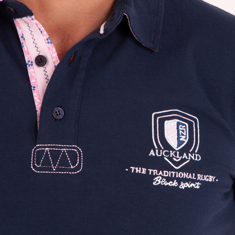 Polo uni détails col et broderies poitrine