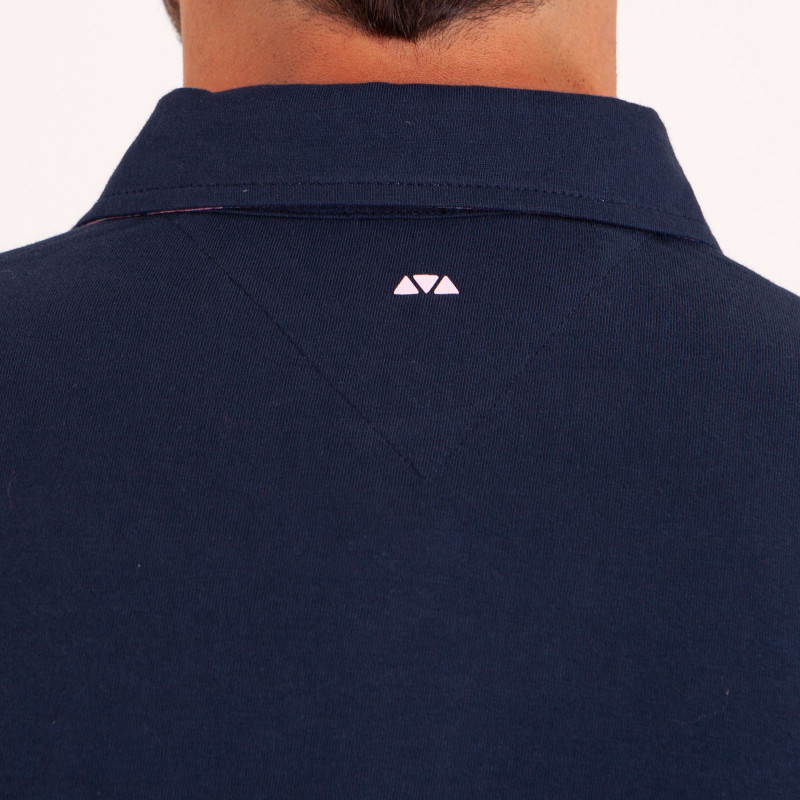 Polo uni détails col et broderies poitrine