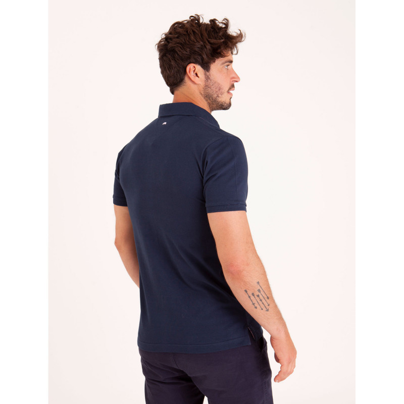 Polo uni détails col et broderies poitrine