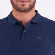 Polo uni en maille cloquée fantaisie