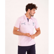 Polo uni détails col et broderies poitrine
