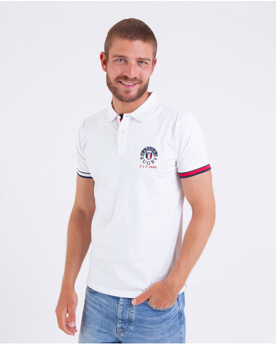 Polo uni manches courtes brodé à la poitrine