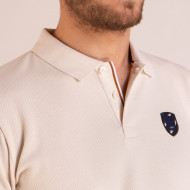 Polo manches longues avec écusson en maille cloquée